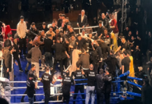 Боксера из РФ забросали стульями после чемпионского боя: на ринге произошла массовая драка (видео)